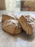 Coffee Cake Scones on a plate, powdered sugar dusted