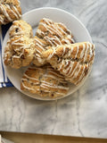 Maple Pecan Scones with maple glaze drizzle, top-down view